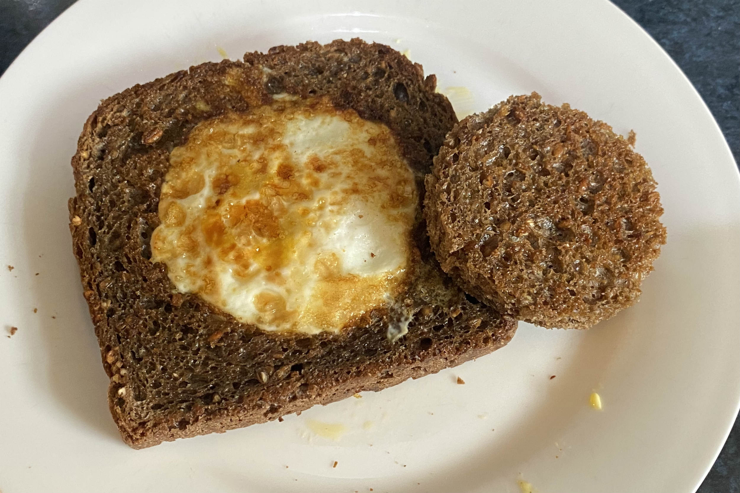 fried toast with egg in the centre and circle of fried toast